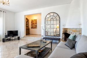 A television and/or entertainment centre at Daphne's Lux Villa