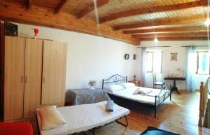 เตียงในห้องที่ Country traditional house in Corfu village, Greece
