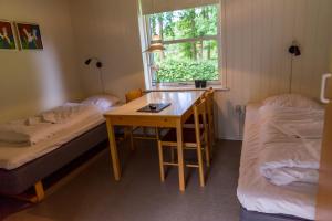 Säng eller sängar i ett rum på Ansager Hotel og Hytteby
