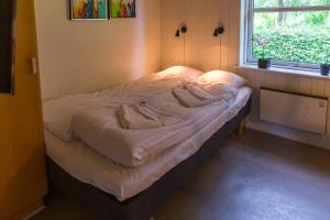 Postel nebo postele na pokoji v ubytování Ansager Hotel og Hytteby