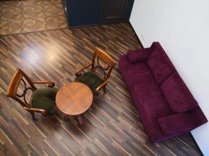 an overhead view of a couch and a table and chair at Затишні апартаменти, вулиця Дерибасівська, 13 in Odesa