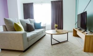 TV a/nebo společenská místnost v ubytování Da Men Sunway Subang By ODY Suites