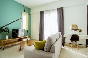 TV a/nebo společenská místnost v ubytování Da Men Sunway Subang By ODY Suites