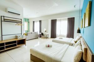 Postel nebo postele na pokoji v ubytování Da Men Sunway Subang By ODY Suites + 11 fotografií