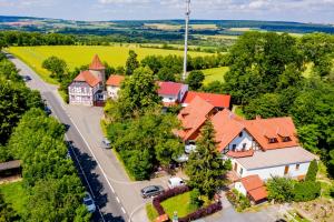 an aerial view of a house with orange roofs at Hotel & Restaurant Lengefelder Warte in Anrode