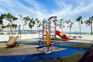 a childrens playground with a slide and a water park at Da Men Sunway Subang By ODY Suites in Subang Jaya