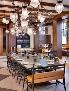 a large dining room with a large table and chairs at The Advenire, Autograph Collection in St. George