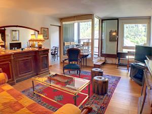 a living room with a table and chairs in it at L'Outa Panoramique in Chamonix