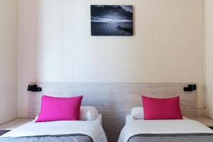 Postel nebo postele na pokoji v ubytování Red Nest Hostel