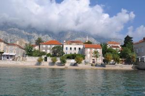 a group of buildings on the shore of a body of water at Apartments Lada in Orebić