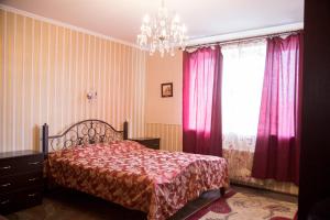 A bed or beds in a room at Guest house Kolo Druziv