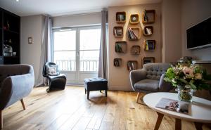 a living room with two couches and a table at 21, Foch in Angers