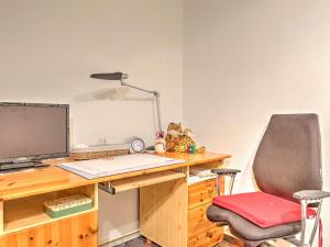 an office with a desk with a computer and a chair at Sunny flat in Bad Driburg with garden in Bad Driburg