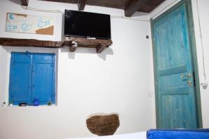 TV a/nebo společenská místnost v ubytování B&B Ziu Anacletu