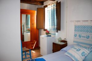 Postel nebo postele na pokoji v ubytování B&B Ziu Anacletu