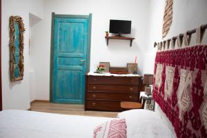 Postel nebo postele na pokoji v ubytování B&B Ziu Anacletu