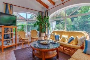 A seating area at Villa Paradise Private pool and garden in a natural park for 9