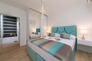Posteľ alebo postele v izbe v ubytovaní Apartman Blue Paradise