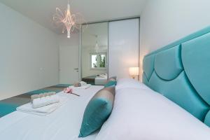 Posteľ alebo postele v izbe v ubytovaní Apartman Blue Paradise