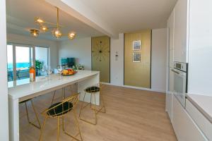 Kuchyňa alebo kuchynka v ubytovaní Apartman Blue Paradise