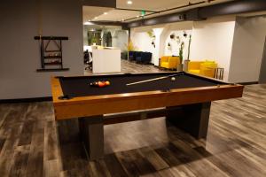 a billiard room with a pool table in an office at Stay Classy in San Diego