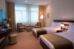 Postel nebo postele na pokoji v ubytování Zirve Hotel