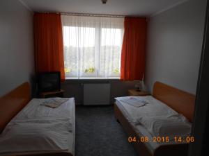 Łóżko lub łóżka w pokoju w obiekcie Na Skarpie