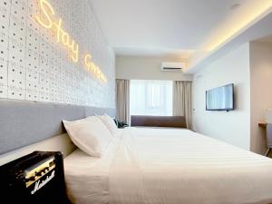 The Atelier Boutique Hotel客房内的一张或多张床位