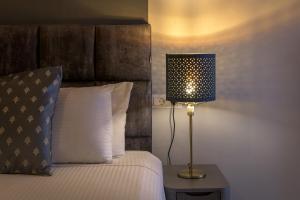Letto o letti in una camera di Grace Hotel & Studios