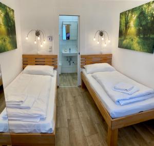 Postel nebo postele na pokoji v ubytování AJO Apartments - Messe City Room - Self-Check-in