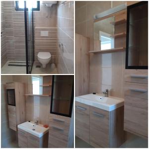 Un baño con lavabo, inodoro y espejo. en Apartments Leo, en Orebić 18 fotos más