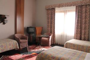 TV a/nebo společenská místnost v ubytování Hotel Costellazioni