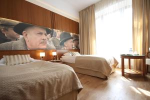 Posteľ alebo postele v izbe v ubytovaní Hotel Vabank
