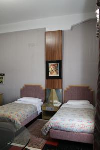 Postel nebo postele na pokoji v ubytování Hotel Costellazioni