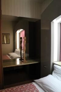 Postel nebo postele na pokoji v ubytování Hotel Costellazioni