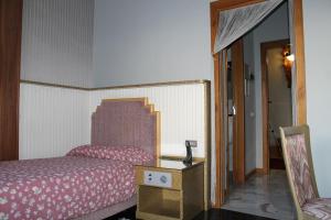Postel nebo postele na pokoji v ubytování Hotel Costellazioni