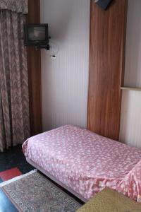 Postel nebo postele na pokoji v ubytování Hotel Costellazioni