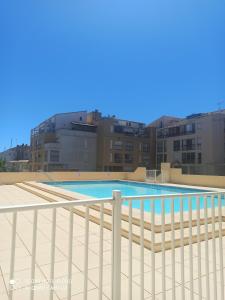 a swimming pool on the roof of a building at Studio centre port,piscine et parking sous terrain in Cap d'Agde