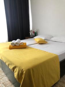 A bed or beds in a room at Sunny Varshava Hotel