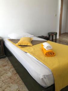 A bed or beds in a room at Sunny Varshava Hotel