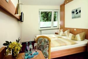 Postel nebo postele na pokoji v ubytování Hotel Waldidyll