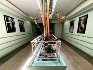 a plant in a basket in a hallway at Hollywood Celebrity Hotel in Los Angeles