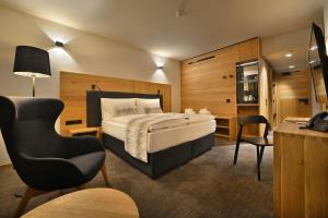Posteľ alebo postele v izbe v ubytovaní Grand Hotel Hradec