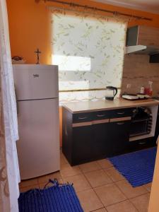 O bucătărie sau chicinetă la Dom i Pokoje Gościnne Zaruby Sejny