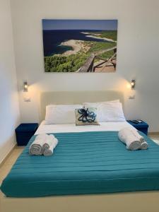 Ένα ή περισσότερα κρεβάτια σε δωμάτιο στο Le Stanze di Marco