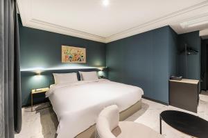 Postel nebo postele na pokoji v ubytování Brown Dot Hotel Ulsan Jangsaengpo
