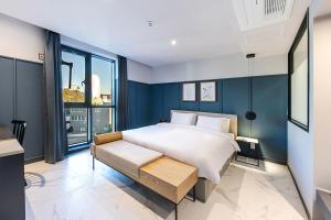 Postel nebo postele na pokoji v ubytování Brown Dot Hotel Ulsan Jangsaengpo