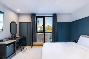 Postel nebo postele na pokoji v ubytování Brown Dot Hotel Ulsan Jangsaengpo