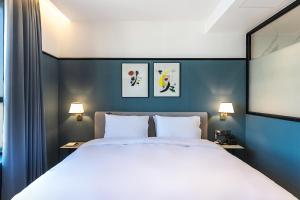 Postel nebo postele na pokoji v ubytování Brown Dot Hotel Ulsan Jangsaengpo