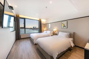 Postel nebo postele na pokoji v ubytování Brown Dot Hotel Ulsan Jangsaengpo